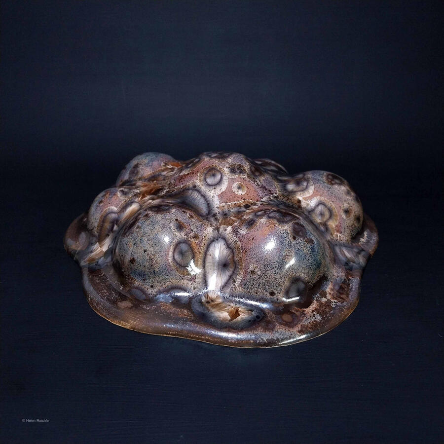 Botryoidal, globular, mammillary shape resembles natural minerals. Chatoyant, amber crystal glaze resembles cat's eye and leopard spots